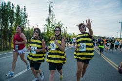 People in costume running the midnight sun run 10k 
