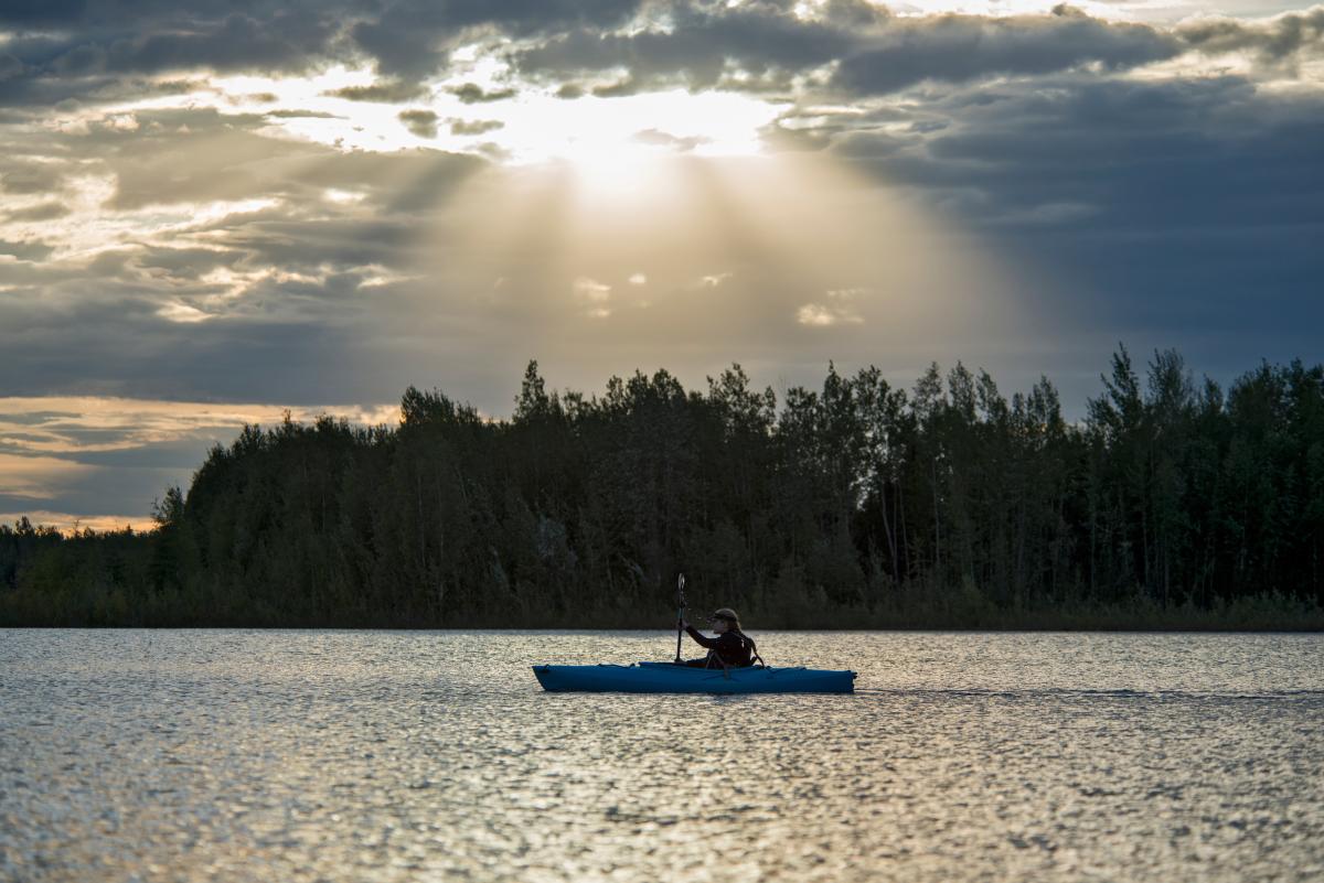 A person kayaking at Chena Lake Recreation Area