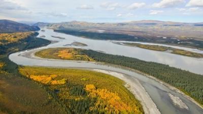 Aerial view of Yukon-Charley Rivers, mountains, and green land