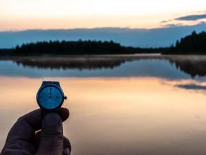 Midnight sun in Fairbanks, Alaska with wristwatch showing the time