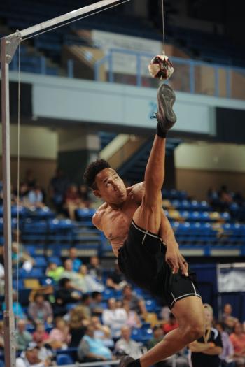 Athlete competing in the high kick at the World Eskimo-Indian Olympics in Fairbanks, Alaska.