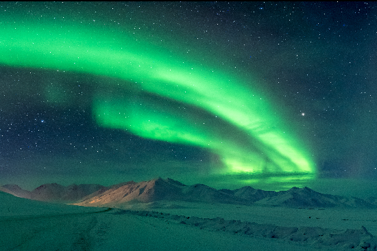 Bright green aurora over Coldfoot, Alaska